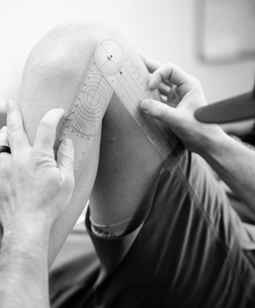 Physical therapist in Pleasanton CA measuring knee range of motion after surgery