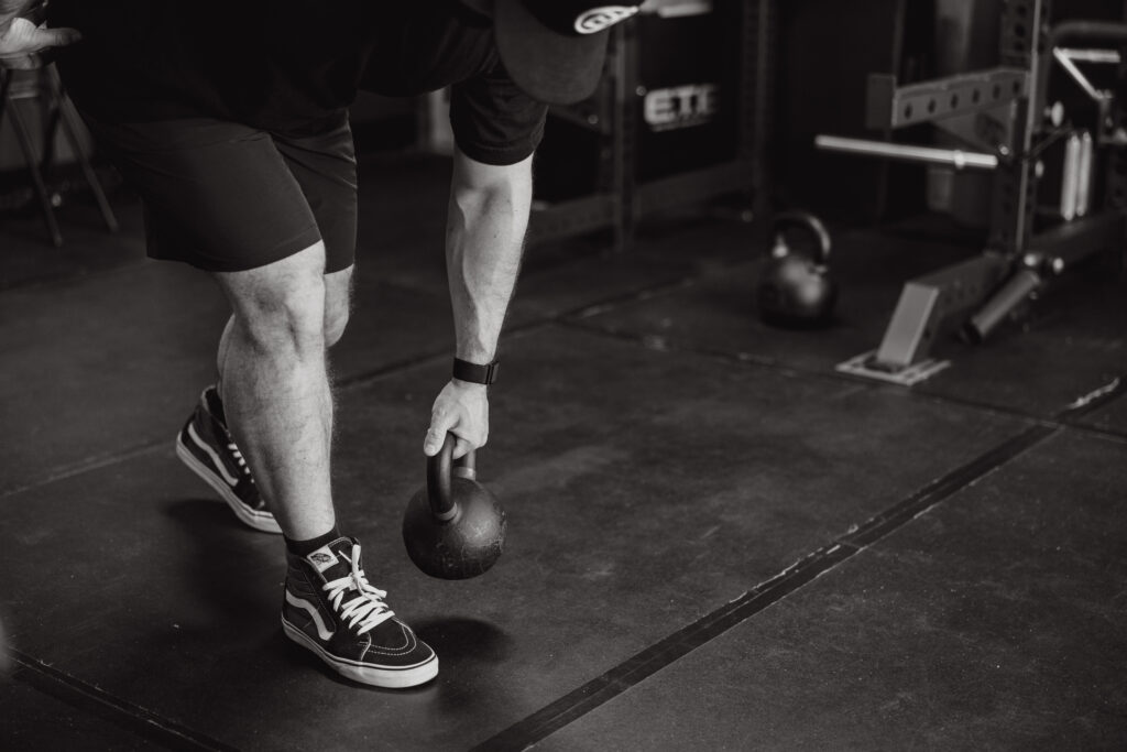 Athlete with low back pain learning hip exercises to rehab from pain