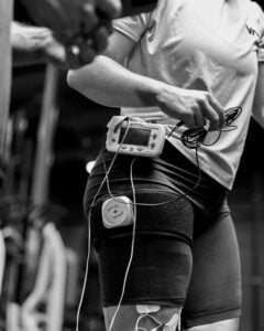 Snowboard athlete performing blood flow restriction training after surgery